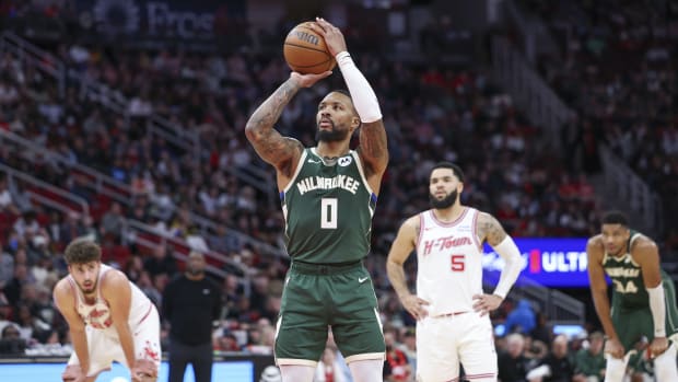 Jan 6, 2024; Houston, Texas, USA; Milwaukee Bucks guard Damian Lillard (0) attempts a free throw during the second quarter against the Houston Rockets at Toyota Center.